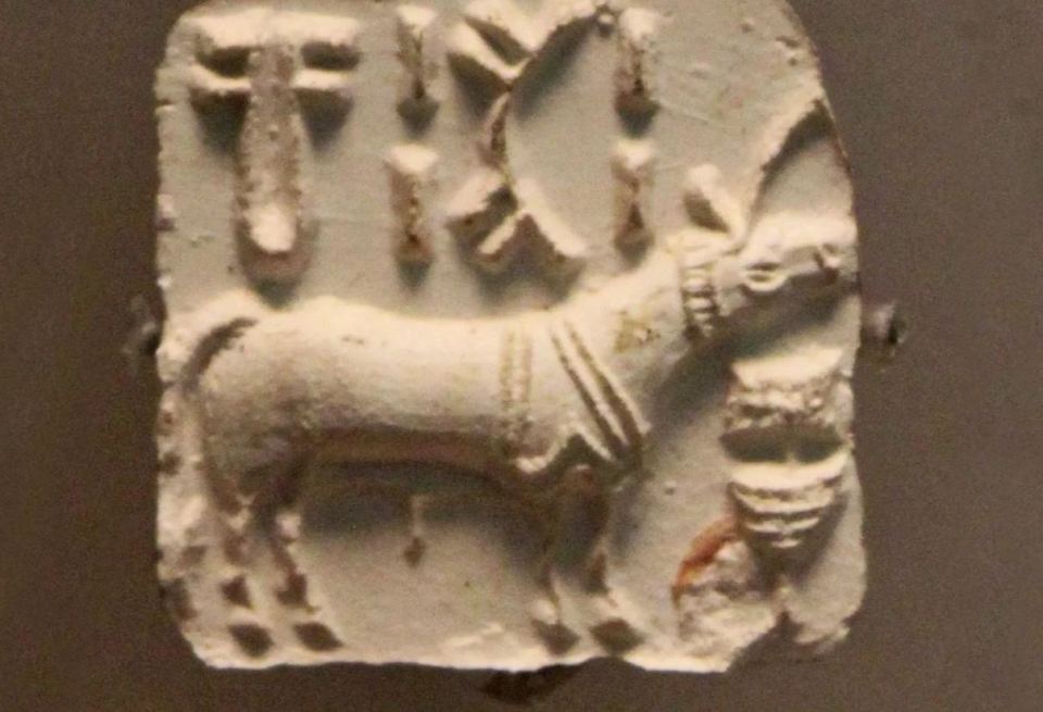 Indus Valley Civilization seal depicting an animal and script.