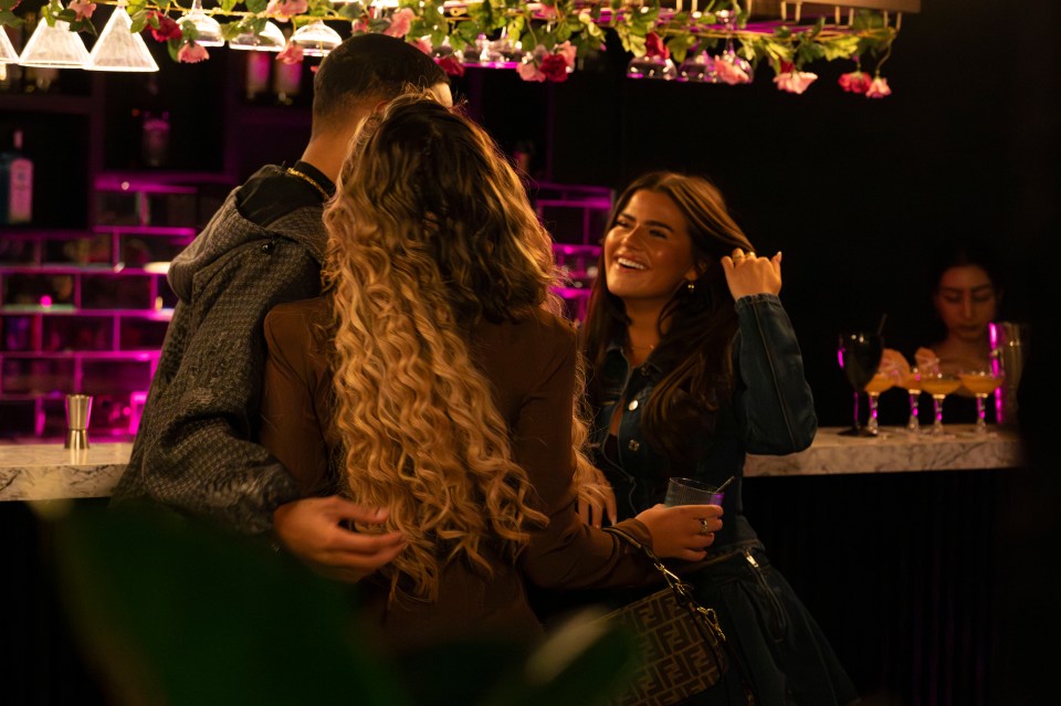 Matilda Draper and Roman Hackett at a bar.