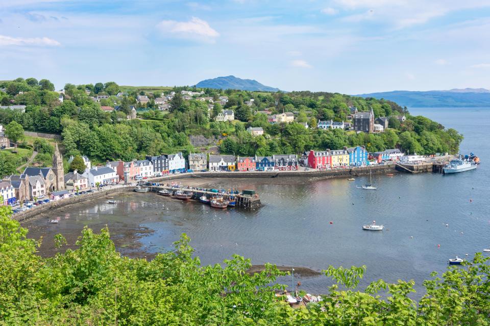 Tobermory harbor with colorful houses and boats.