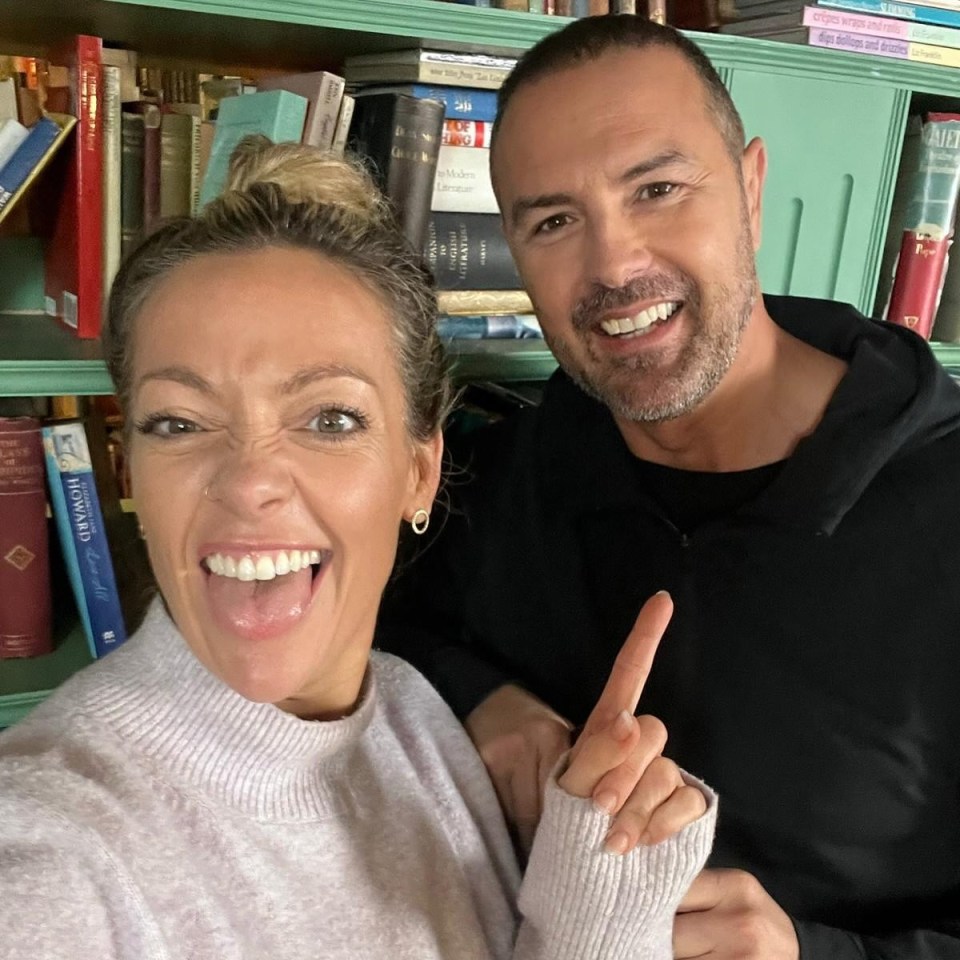 Paddy McGuinness and a woman in front of a bookshelf.