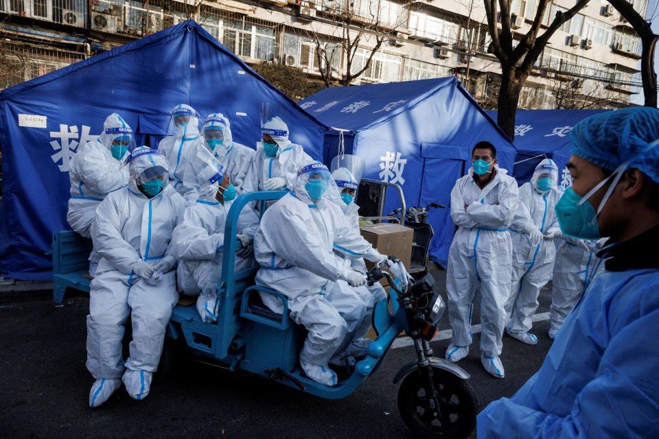 Pandemic prevention workers head out for their shift in Beijing in 2022