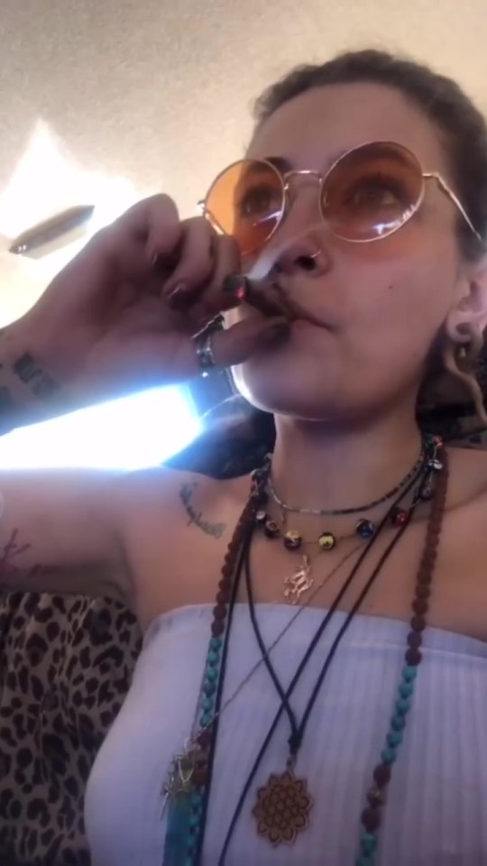 Paris Jackson smoking a cigarette.