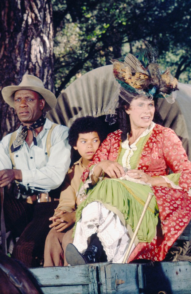 Scene from Little House on the Prairie: Moses Gunn, Ivan Wideman, and Katherine MacGregor in a wagon.