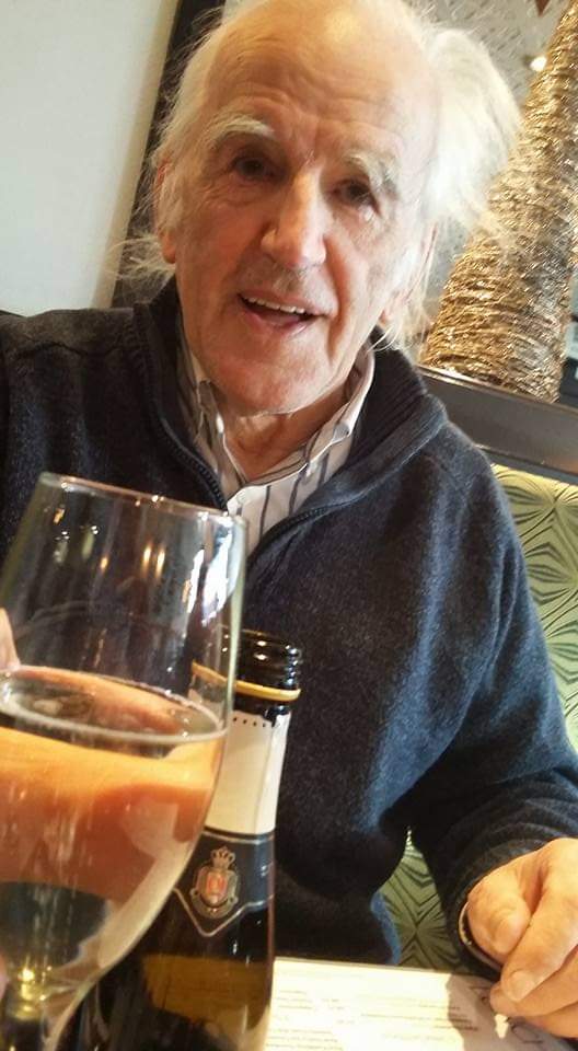 Paul Stewart Laing, British TV legend, raising a glass of champagne.