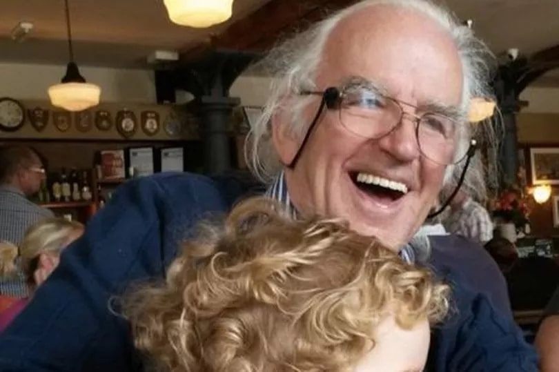 Paul Stewart Laing, British TV legend, hugging a child.