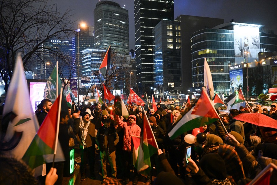 People celebrating a ceasefire agreement outside the Israeli consulate in Istanbul.