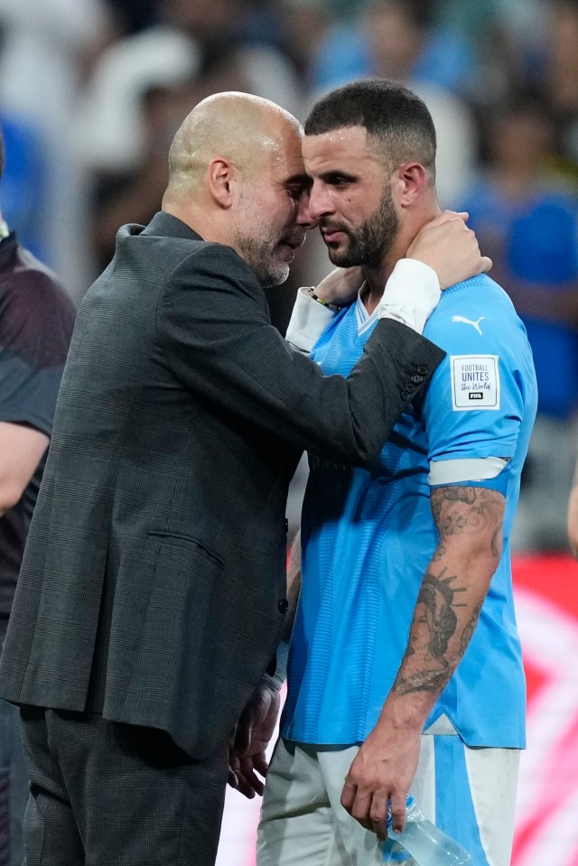 Pep Guardiola and Kyle Walker embrace after a Manchester City victory.