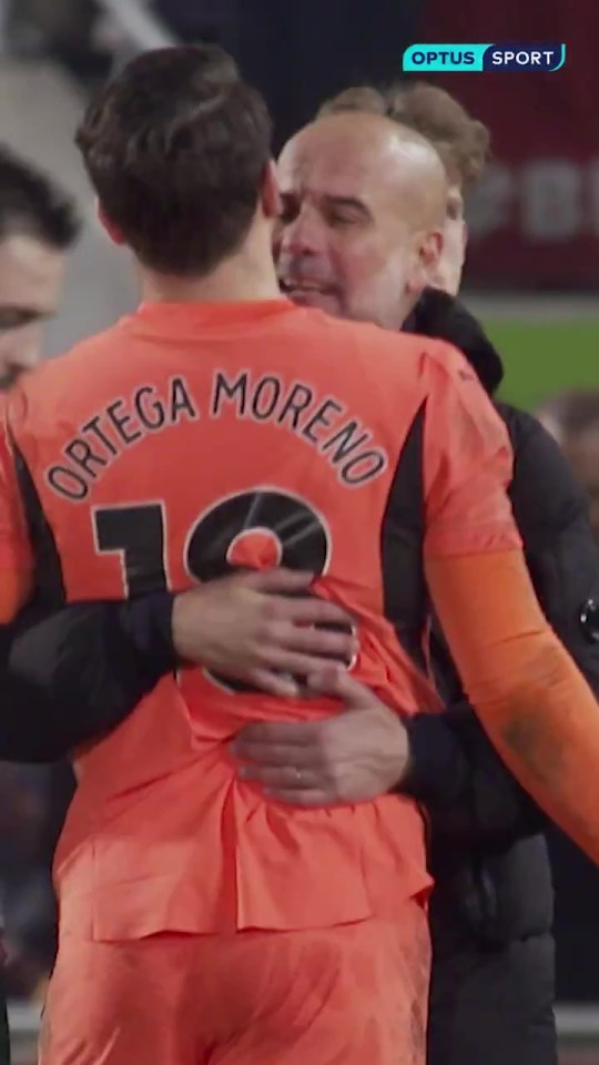 Pep Guardiola embracing Stefan Ortega.