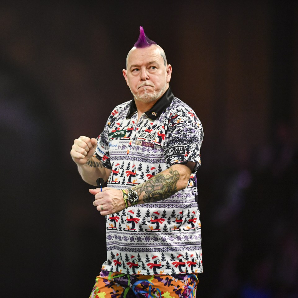 Peter Wright celebrating a darts match victory.