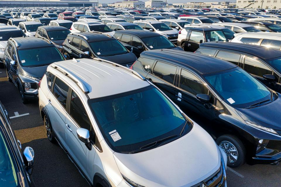 Aerial view of a large lot filled with new cars.