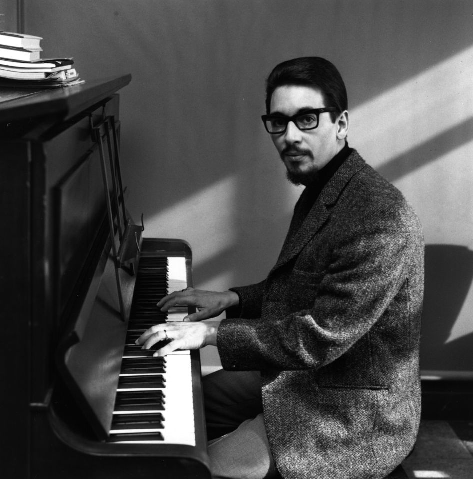 Black and white photo of Laurie Holloway playing the piano.