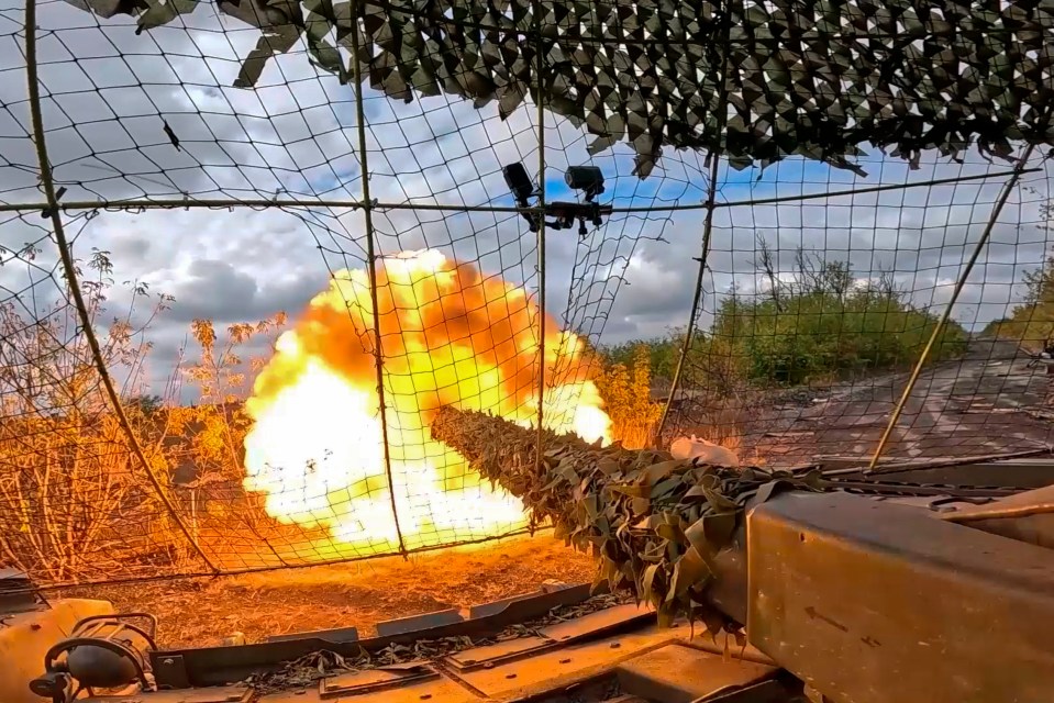 A Russian tank fires towards Ukrainian positions