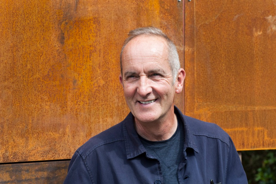 Kevin McCloud smiling.