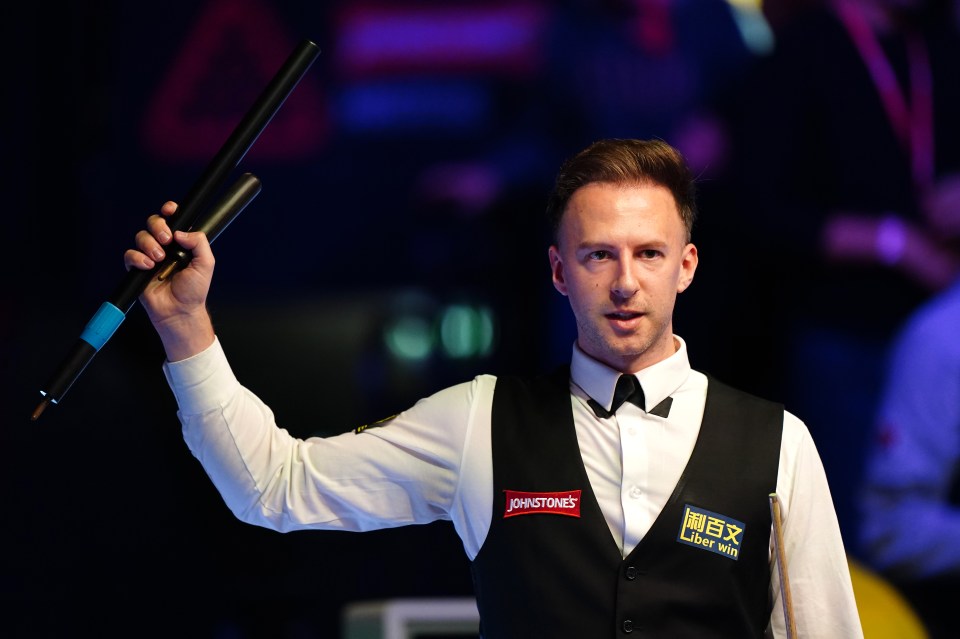 Judd Trump celebrating a snooker victory.