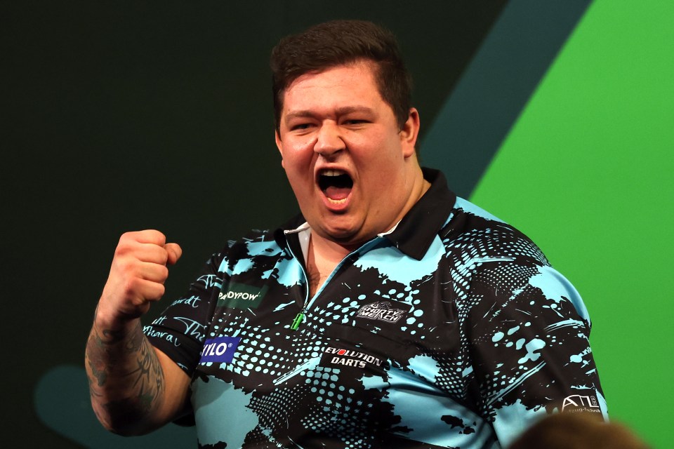 Kai Gotthardt celebrates a darts win.