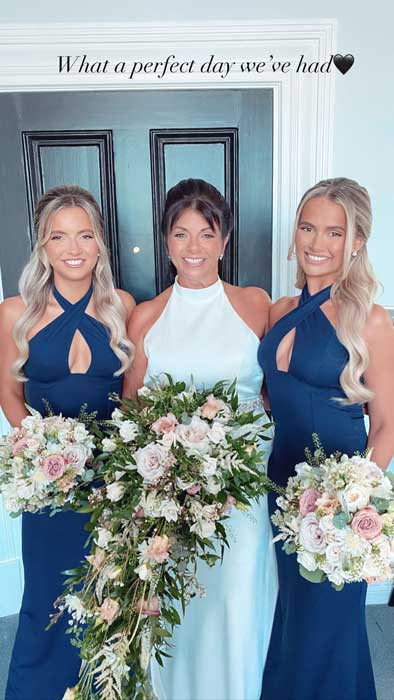 A mother and her two daughters at a wedding.