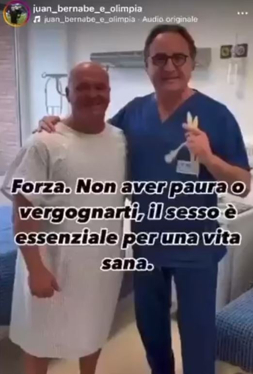 Photo of a man in a hospital gown with a doctor.