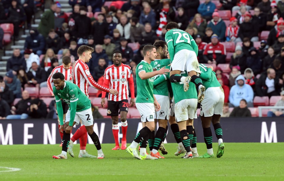 Plymouth Argyle players celebrating a goal.