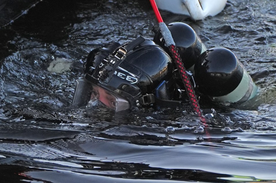 Police diver searching the River Dee in Aberdeen.