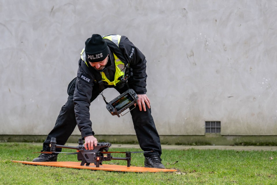 Police officer deploying a drone.