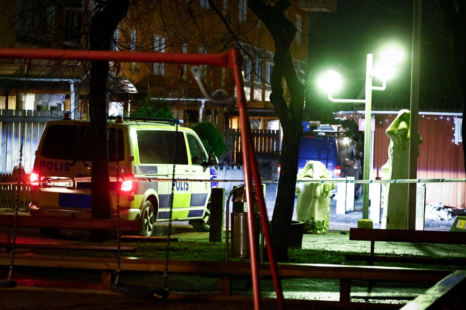 Police van at a crime scene at night.