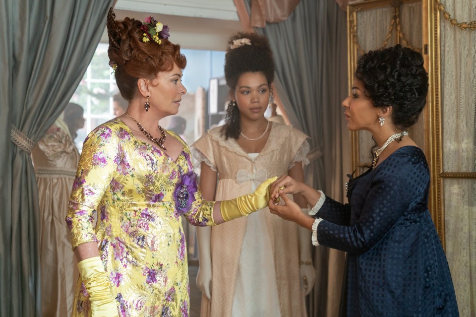 Polly Walker as Portia Featherington, Ruby Barker as Marina Thompson, and Kathryn Drysdale as Genevieve in a scene from Bridgerton.