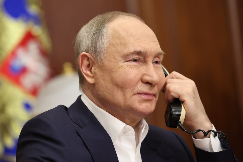 Russia’s President Vladimir Putin talks on the phone