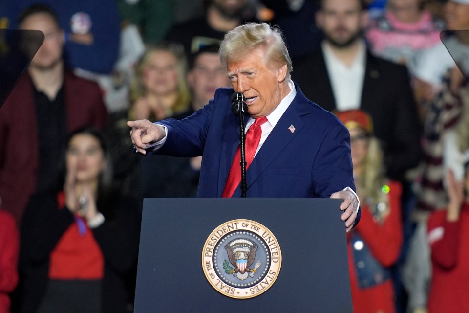 President Donald Trump speaking at a podium.