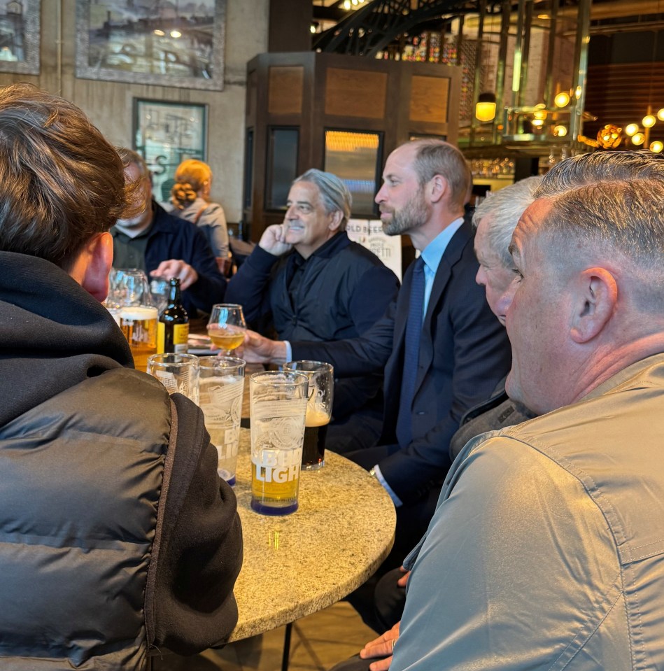 The Prince of Wales meeting with Aston Villa supporters in a pub.