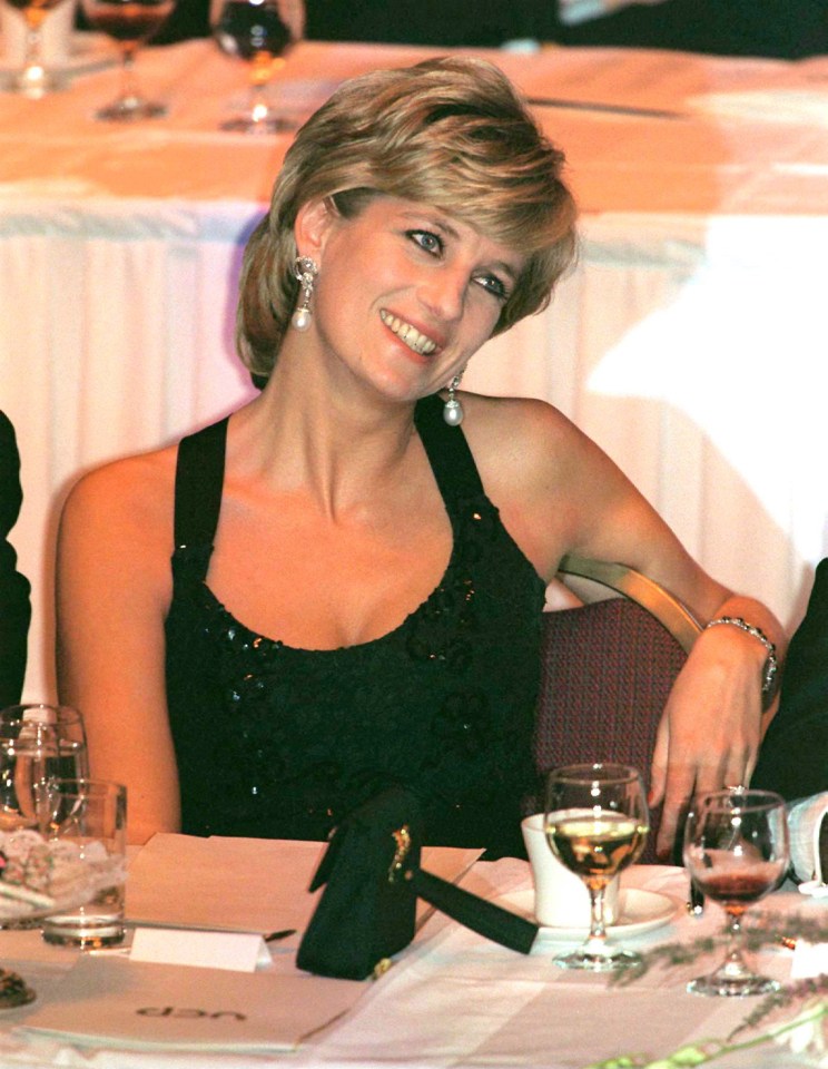 Princess Diana smiling at a dinner in New York City.