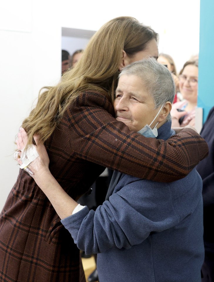 The Princess of Wales hugs a cancer patient at the Royal Marsden Hospital.