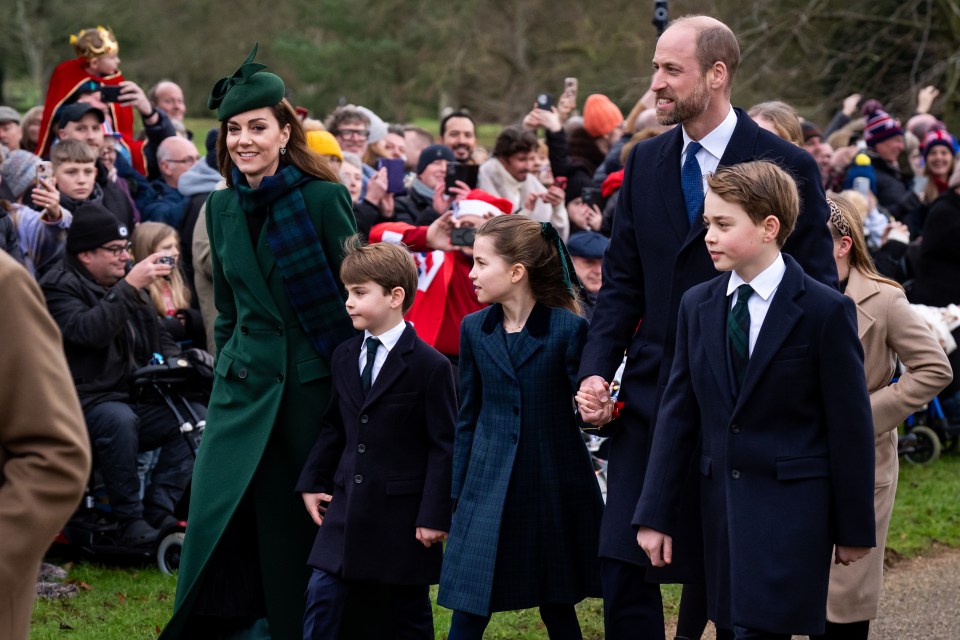 The Prince and Princess of Wales with their three children walking amongst well-wishers.