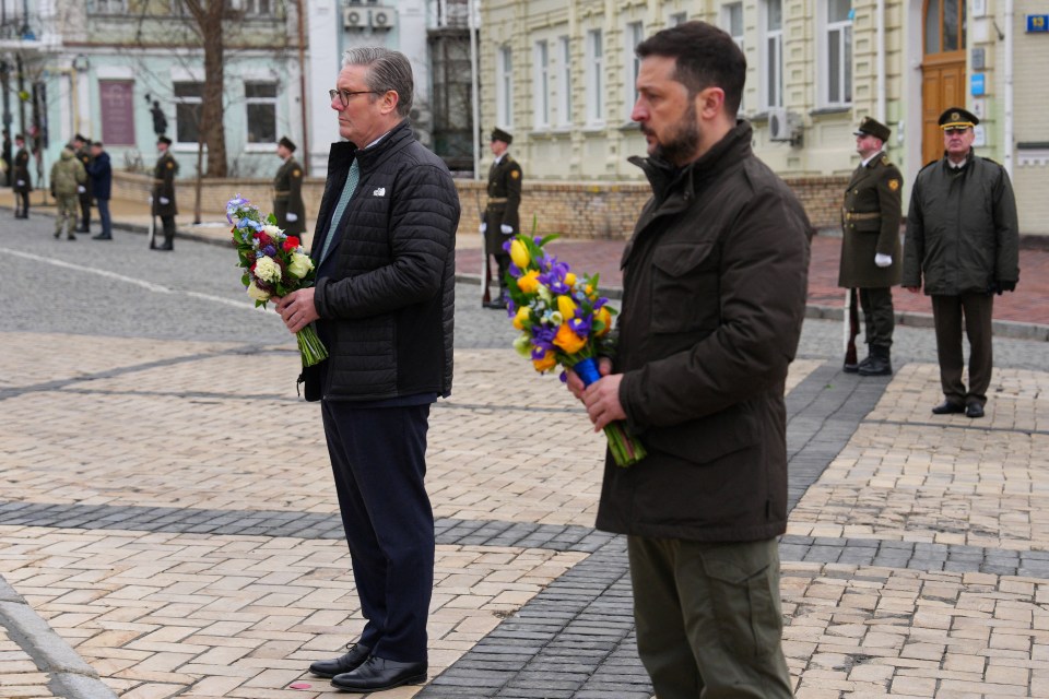 Keir Starmer and Volodymyr Zelenskyy holding wreaths.