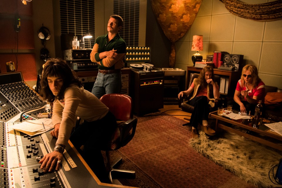 Still from Bohemian Rhapsody showing Rami Malek as Freddie Mercury in a recording studio with other band members.