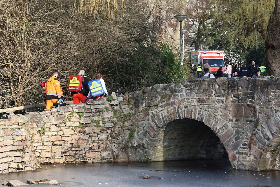 Rescue workers near a crime scene.