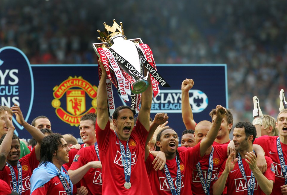 Rio Ferdinand of Manchester United lifts the Premier League trophy.