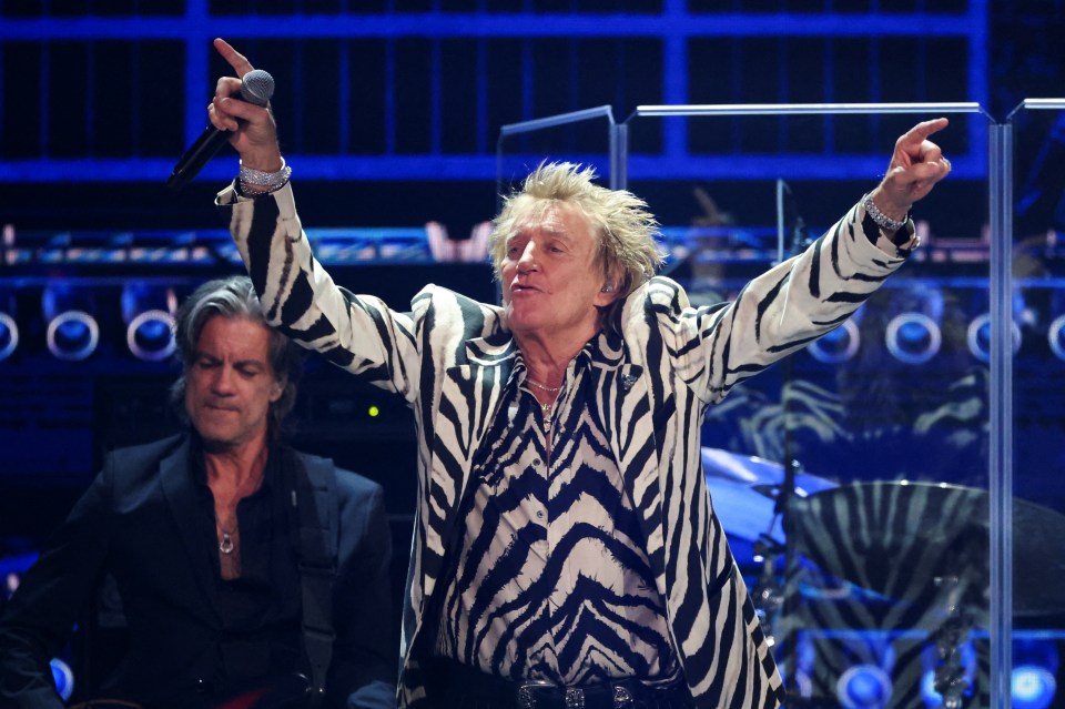 Rod Stewart performing at a FireAid benefit concert.