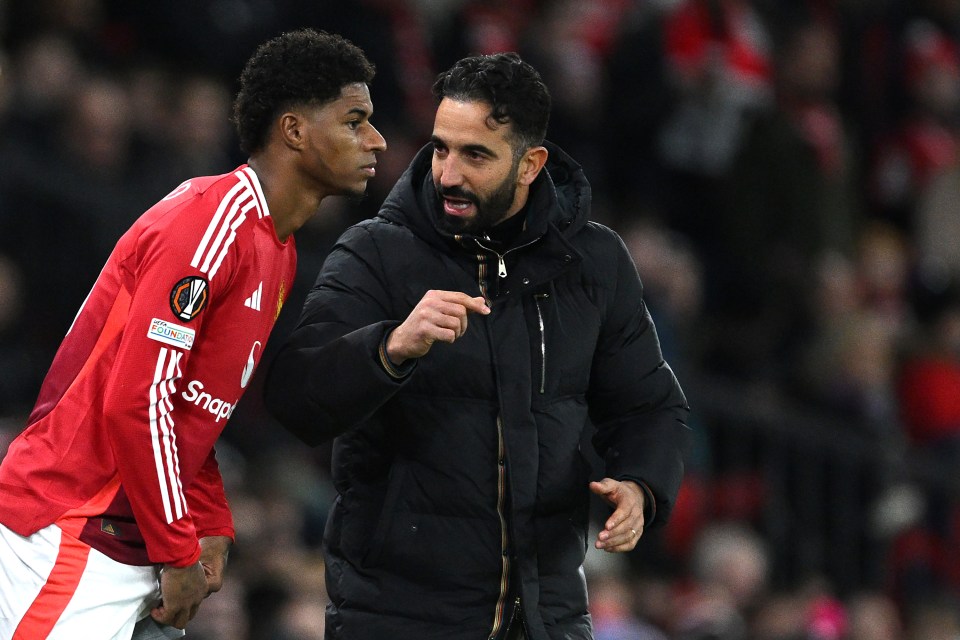 Ruben Amorim, Manchester United's head coach, speaks with Marcus Rashford.