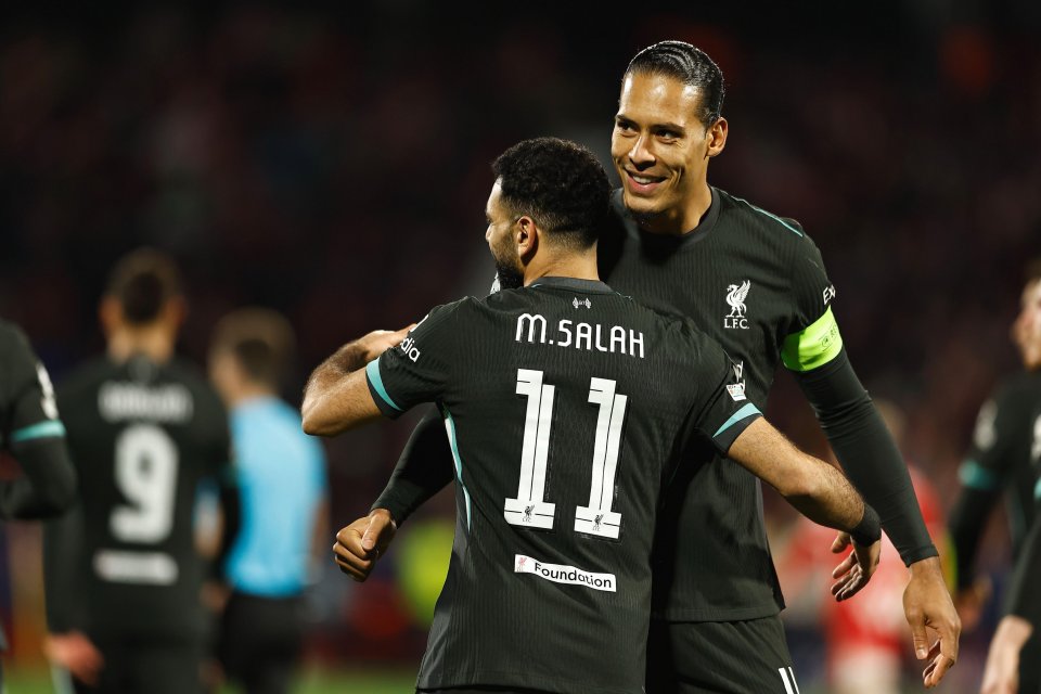 Mohamed Salah and Virgil van Dijk celebrating a goal.