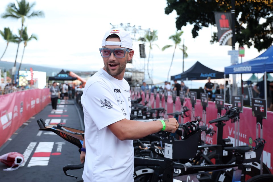 Sam Laidlow of France prepares his bike at the 2024 Ironman World Championship transition area.