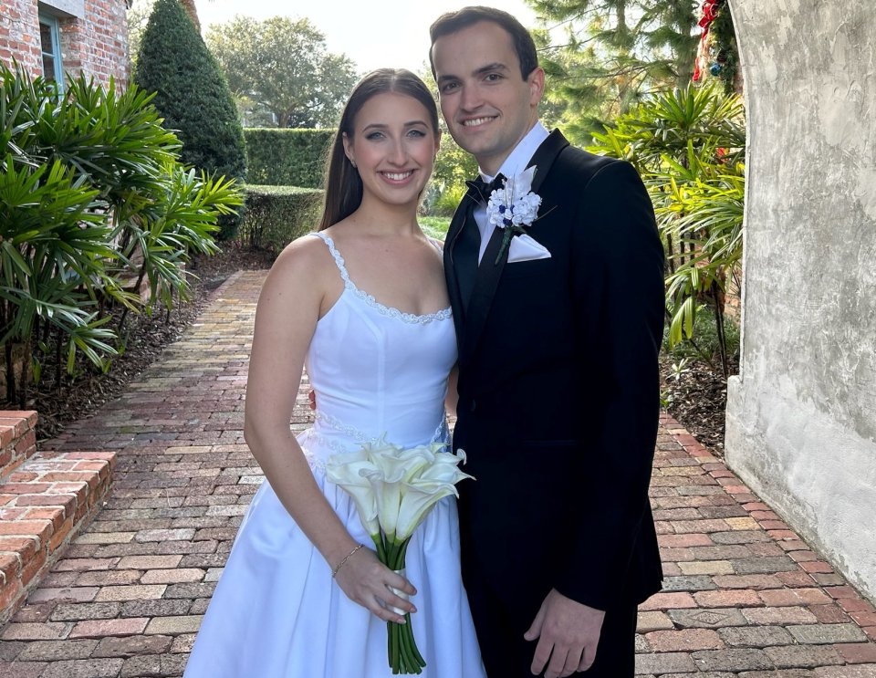 Bride and groom posing for a wedding photo.