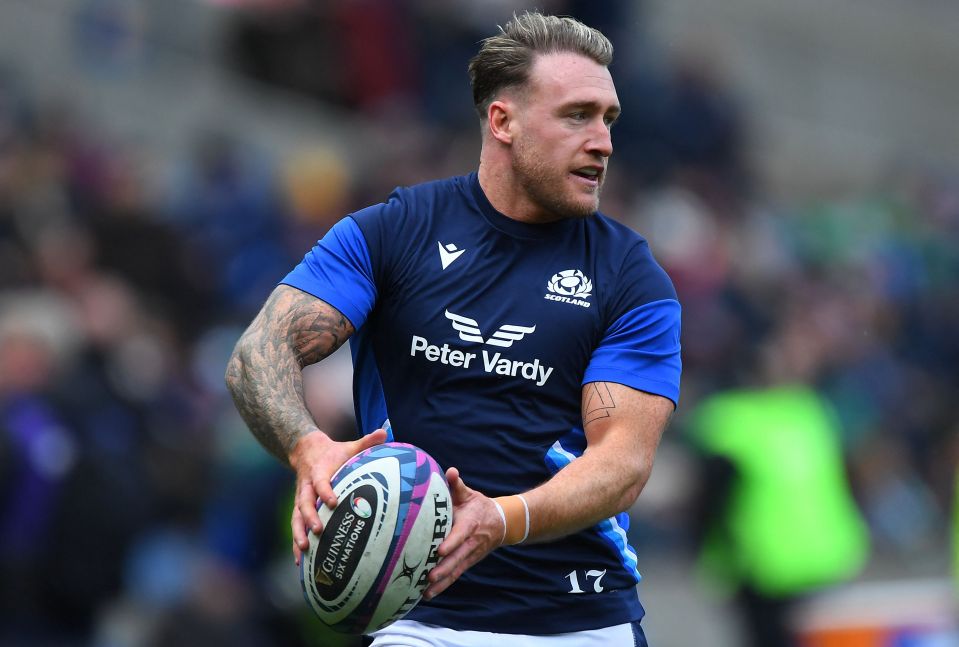 Stuart Hogg, Scotland's fullback, warming up with a rugby ball.