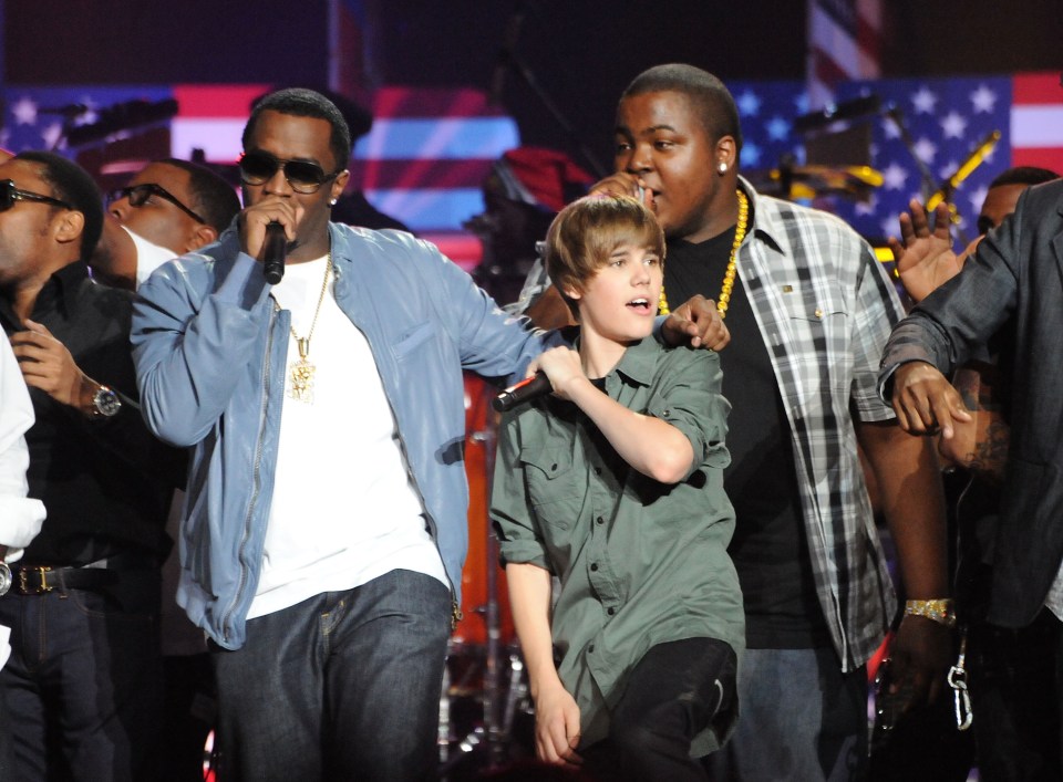 Sean "Diddy" Combs and Justin Bieber performing at a concert.