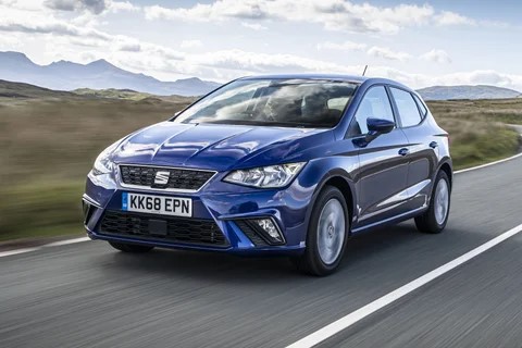 SEAT Ibiza driving on a road.