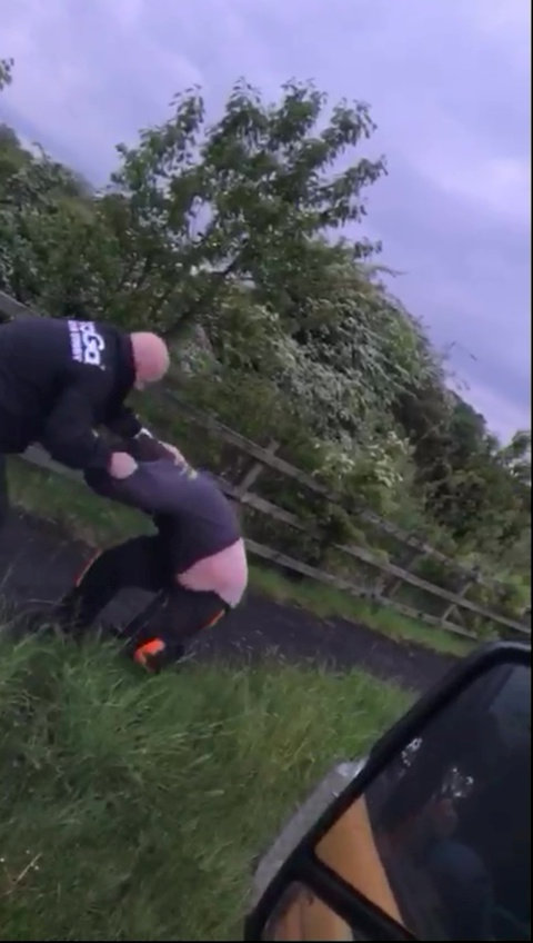 The two men grappling at a layby