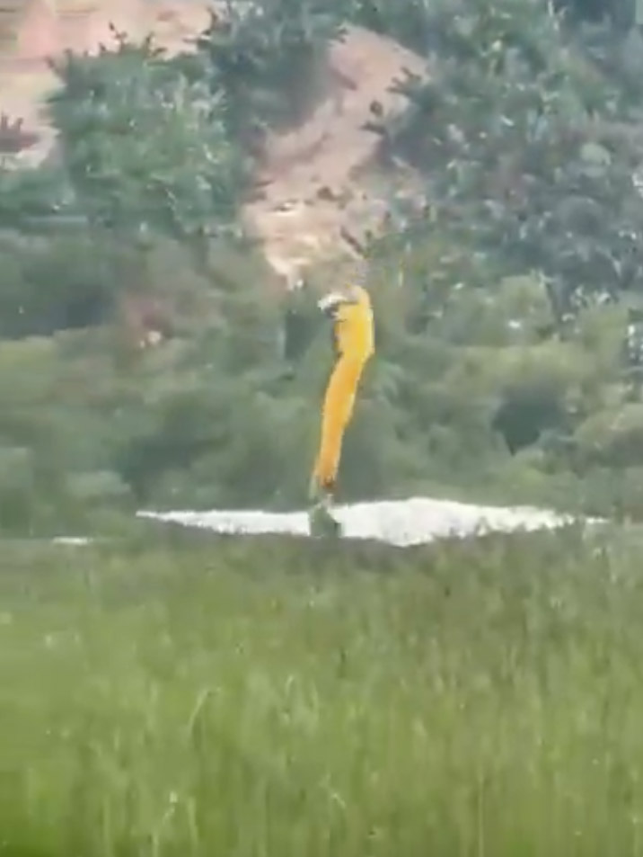 Video still of a skydiver falling to the ground.