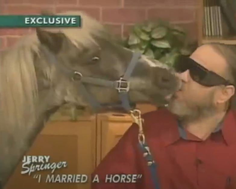 A Shetland pony kissing a man on the Jerry Springer show, episode "I Married a Horse".