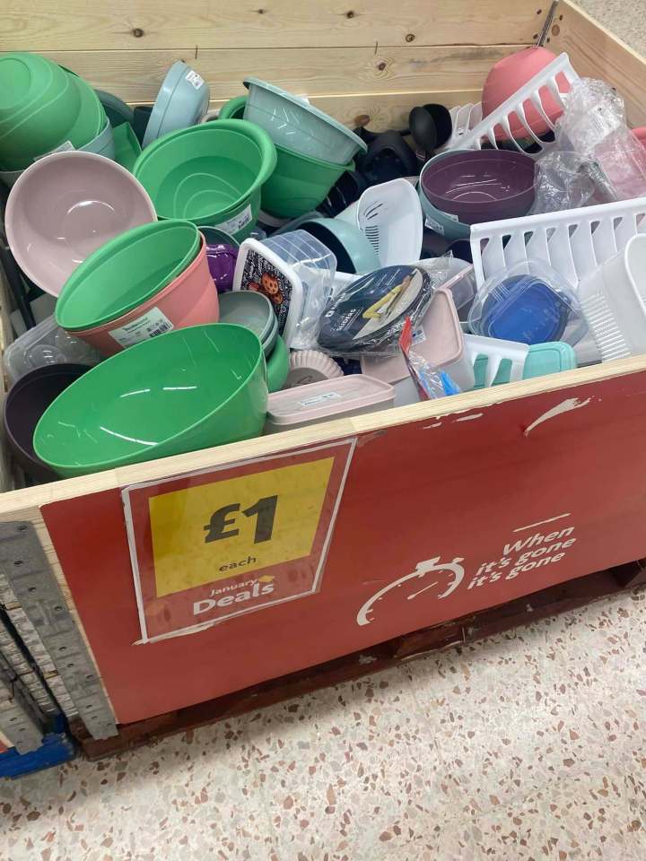 A crate of kitchen bowls and utensils for £1 each.