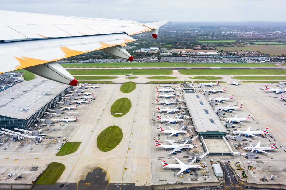 Aerial view of Heathrow Airport Terminal 5 with many British Airways planes.