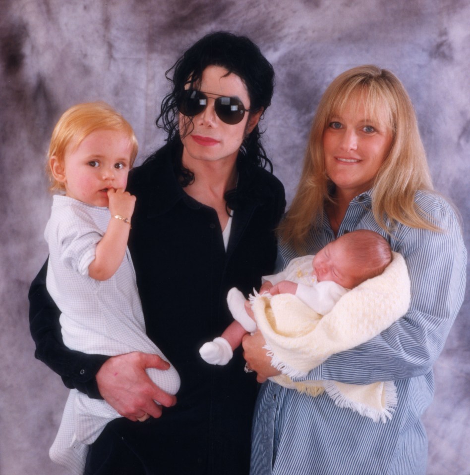 Michael Jackson with Debbie Rowe and their two young children.